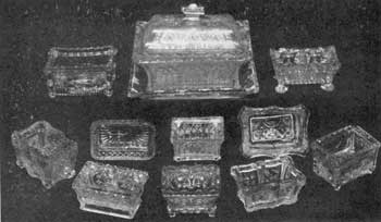 Characteristic Designs in the Oblong Shape: For comparison, in center top row, is the rare Lacy Sandwich covered relish dish with tray in Gothic design. The tray is 7-1/8 inches long and the piece 5 inches to top of knob. Immediately below is a Gothic-pattern salt dish. The two in the bottom row have double compartments. Characteristic Designs in the Oblong Shape: For comparison, in center top row, is the rare Lacy Sandwich covered relish dish with tray in Gothic design. The tray is 7-1/8 inches long and the piece 5 inches to top of knob. Immediately below is a Gothic-pattern salt dish. The two in the bottom row have double compartments.