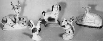 Characteristic Pennsylvania Chalk Animal Figures: All except the squirrel with nut in fore paws are like Staffordshire pottery figures made at least a half century earlier. The reclining deer, impressed "1883-15c." ressembles those of Bennington pottery. The spaniel is posed like a Staffordshire example. The others are akin to animals made in redware and stoneware by the 19th-Century Pennsylvania potteries. The rooster is dated 1879. As the animals are hollow, a coin slot was sometimes cut in the back for use as a penny bank. These animals were often made in facing pairs. All date from about 1850-85. Characteristic Pennsylvania Chalk Animal Figures: All except the squirrel with nut in fore paws are like Staffordshire pottery figures made at least a half century earlier. The reclining deer, impressed "1883-15c." ressembles those of Bennington pottery. The spaniel is posed like a Staffordshire example. The others are akin to animals made in redware and stoneware by the 19th-Century Pennsylvania potteries. The rooster is dated 1879. As the animals are hollow, a coin slot was sometimes cut in the back for use as a penny bank. These animals were often made in facing pairs. All date from about 1850-85.