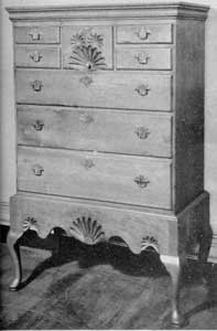 Cherry Chest on Frame: The flat cornice molding and sunburst carvings are characteristic of the earlier work of the Queen Anne period, particularly in New England. Cherry Chest on Frame: The flat cornice molding and sunburst carvings are characteristic of the earlier work of the Queen Anne period, particularly in New England.