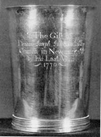 Communion Cup, by Cario: Made by William Cario II, it was a bequest to the church in Newmarket, New Hampshire, where this silversmith worked after leaving Portsmouth. The inscription reads: "The Gift of Deacon Joseph Judkins, to the Church in Newmarkett, by his Last Will 1770." Communion Cup, by Cario: Made by William Cario II, it was a bequest to the church in Newmarket, New Hampshire, where this silversmith worked after leaving Portsmouth. The inscription reads: "The Gift of Deacon Joseph Judkins, to the Church in Newmarkett, by his Last Will 1770."