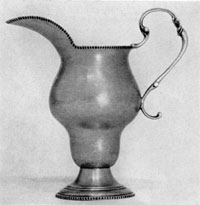 Creamer by Elias Pelletreau: Here, the 18th-Century inverted pear shape was modified. A circular base replaced legs, but the early influence persists. Pelletreau, an apprentice of Soumain, worked at Southampton, Long Island, 1750-1810. His son and grandson were also silversmiths. Creamer by Elias Pelletreau: Here, the 18th-Century inverted pear shape was modified. A circular base replaced legs, but the early influence persists. Pelletreau, an apprentice of Soumain, worked at Southampton, Long Island, 1750-1810. His son and grandson were also silversmiths.