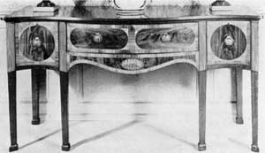 English sideboard with effective use of satinwood inlay and banding, contrasting with crotch mahogany veneer. English sideboard with effective use of satinwood inlay and banding, contrasting with crotch mahogany veneer.