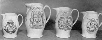Four Liverpool Masonic Pitchers: All have black transfer decoration. Figure 4: a rare pitcher with design by P. Lambert; Figure 5: large pitcher, dated 1798; Figure 6: pitcher with Masonic coat-of-arms and many emblems; Figure 7: a seaman's jug with circular design incorporating numerous Masonic emblems. Four Liverpool Masonic Pitchers: All have black transfer decoration. Figure 4: a rare pitcher with design by P. Lambert; Figure 5: large pitcher, dated 1798; Figure 6: pitcher with Masonic coat-of-arms and many emblems; Figure 7: a seaman's jug with circular design incorporating numerous Masonic emblems.