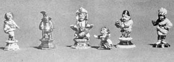 Illustration IX: A Group of Callot Figures: Made 1712 to 1719 and unmarked, some were decorated with gold foil attached with lacquer; others with fired gold. Average height, three and one-half inches. Illustration IX: A Group of Callot Figures: Made 1712 to 1719 and unmarked, some were decorated with gold foil attached with lacquer; others with fired gold. Average height, three and one-half inches.