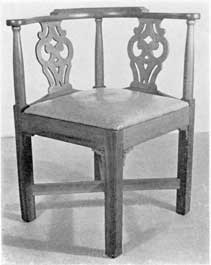 Illustration X: A semi-sophisticated chair of cherry with pierced backsplat. In the Chippendale manner, it was made circa 1765-1785. The rectangular cross stretchers and ornamental brackets beneath the joining of seat frame and legs are unusual. The curved arms and comb are restrained in outline. Illustration X: A semi-sophisticated chair of cherry with pierced backsplat. In the Chippendale manner, it was made circa 1765-1785. The rectangular cross stretchers and ornamental brackets beneath the joining of seat frame and legs are unusual. The curved arms and comb are restrained in outline.