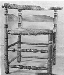 Illustration III: An unusually compact chair with noticeably low back. Made of maple with ash slats, only the stretchers at the front are ornamentally turned Illustration III: An unusually compact chair with noticeably low back. Made of maple with ash slats, only the stretchers at the front are ornamentally turned