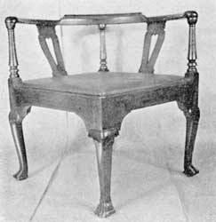 Illustration VIII: A remarkably large chair. Made about 1720, it has four cabriole legs terminating in Spanish feet and no cross stretchers, which is most unusual in American chairs of this type. Illustration VIII: A remarkably large chair. Made about 1720, it has four cabriole legs terminating in Spanish feet and no cross stretchers, which is most unusual in American chairs of this type.