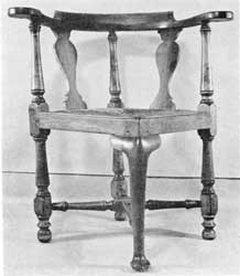 Illustration IX: Of the commode type, this mahogany chair has always been part of the office furniture of the Walter Baker chocolate mill in Dorchester, Massachusetts. Records of other chairs purchased by Dr. James Baker in 1771 from Ezra Badlam, Boston cabinetmaker, suggest that he may also have acquired this one at the same time. Illustration IX: Of the commode type, this mahogany chair has always been part of the office furniture of the Walter Baker chocolate mill in Dorchester, Massachusetts. Records of other chairs purchased by Dr. James Baker in 1771 from Ezra Badlam, Boston cabinetmaker, suggest that he may also have acquired this one at the same time.