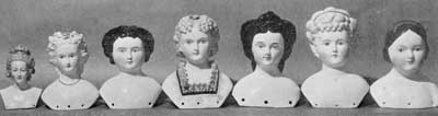 Illustration V: Imported Doll Heads of the 19th Century: From left to right the materials used are, Meissen, Parian ware, china, Parian, china, bisque, and china. The fifth head depicts the Empress Eugenie; the seventh, Jenny Lind. Illustration V: Imported Doll Heads of the 19th Century: From left to right the materials used are, Meissen, Parian ware, china, Parian, china, bisque, and china. The fifth head depicts the Empress Eugenie; the seventh, Jenny Lind.