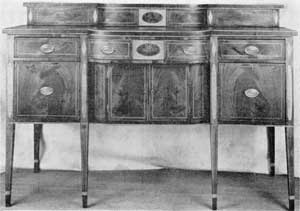 Side-board Made at Charleston, S. C.: This piece has a double deck. The shaping of this and that of the front are identical. Some sideboards with these features were made in England, but in America they were made only by the cabinetmakers of Charleston. Side-board Made at Charleston, S. C.: This piece has a double deck. The shaping of this and that of the front are identical. Some sideboards with these features were made in England, but in America they were made only by the cabinetmakers of Charleston.