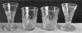 Illustration V: Miniature Flip and Cordial Glasses: All are undoubtedly of Sandwich origin. The flip glasses, or toy tumblers, are two and one-quarter inches high; the cordial glasses, two and one-half inches high. Illustration V: Miniature Flip and Cordial Glasses: All are undoubtedly of Sandwich origin. The flip glasses, or toy tumblers, are two and one-quarter inches high; the cordial glasses, two and one-half inches high.
