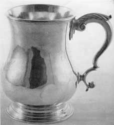 Silver Mug by Gilbert: This piece originally belonged to Nicholas Bayard and bears his family crest on the side. The shaping of the handle is unusually bold.