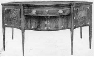 A New York Sideboard, Circa 1790: Here the inlay ornamentation is distinctive, particularly the bellflower pendants that decorate the legs. A New York Sideboard, Circa 1790: Here the inlay ornamentation is distinctive, particularly the bellflower pendants that decorate the legs.