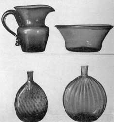 Illustration VI: Other Examples, Probably Ohio Glass: Top row, left, a large free-blown pitcher, not patterned, in dark amber glass attributed to Zanesville; right, bowl of golden amber glass, not patterned. Lower row, left, chestnut flask with broken swirl in deep amber glass; and right, grandfather flask in clear glass with expanded ribbing. Illustration VI: Other Examples, Probably Ohio Glass: Top row, left, a large free-blown pitcher, not patterned, in dark amber glass attributed to Zanesville; right, bowl of golden amber glass, not patterned. Lower row, left, chestnut flask with broken swirl in deep amber glass; and right, grandfather flask in clear glass with expanded ribbing.