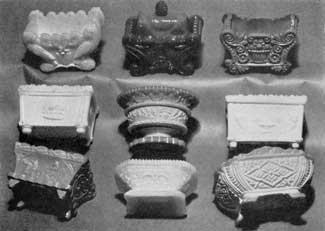 Salt Dishes in Opaque Glass: Some of these, notably the round-footed dish, second row center, and the oblong one, lower row left, were executed to simulate the earlier Wedgwood pottery with raised classic decorative motifs. The others are from molds used also for transparent and opalescent glass. Salt Dishes in Opaque Glass: Some of these, notably the round-footed dish, second row center, and the oblong one, lower row left, were executed to simulate the earlier Wedgwood pottery with raised classic decorative motifs. The others are from molds used also for transparent and opalescent glass.