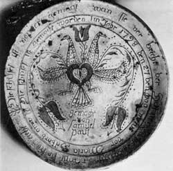 Signed by Samuel Paul: The inscription in the two circular bands at the rim is in German and includes the date 1798. His pottery was near Tylersport. Here the decorative motifs are a double-headed bird and tulips. Signed by Samuel Paul: The inscription in the two circular bands at the rim is in German and includes the date 1798. His pottery was near Tylersport. Here the decorative motifs are a double-headed bird and tulips.