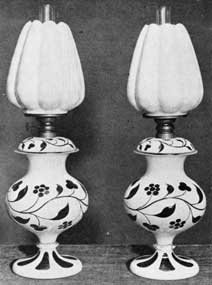 Handsome Sandwich Lamps: Made with opaque white and rose-colored overlay glass bases and shades of a delicate pink glass with translucent white on the outside. Lamps such as these date from the time when kerosene had replaced other fuels for lighting purposes. Handsome Sandwich Lamps: Made with opaque white and rose-colored overlay glass bases and shades of a delicate pink glass with translucent white on the outside. Lamps such as these date from the time when kerosene had replaced other fuels for lighting purposes.
