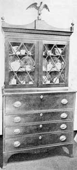 Secretary Attributed to The Appletons: The carved eagle finial, shaping of the cornice, and diamond paned doors, are all like those found on other pieces of Salem origin. Secretary Attributed to The Appletons: The carved eagle finial, shaping of the cornice, and diamond paned doors, are all like those found on other pieces of Salem origin.