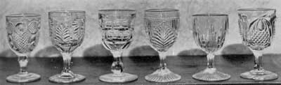 Six More Pattern Glass Goblets: The individual patters are, left to right: Horn of Plenty; Inverted Fern; and unidentified deisgn; Ribbed Palm, Icicle, and New England Pineapple. Six More Pattern Glass Goblets: The individual patters are, left to right: Horn of Plenty; Inverted Fern; and unidentified deisgn; Ribbed Palm, Icicle, and New England Pineapple.