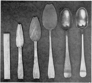 From Strip of Metal to Finished Spoon: From left to right, these six stages show the principal steps followed by Early American silversmiths in spoonmaking. It started with the strip of rolled silver at the left. Next, shaping of the bowl and handle was started and continued through three stages. Then with a punch and die the bowl was "struck up" that is, made concave and the handle was given its proper curve. After this, the edges were smoothed with files and the spoon carefully polished with burnishing tools. This set of steps follows the design of a Paul Revere spoon made about 1770. From Strip of Metal to Finished Spoon: From left to right, these six stages show the principal steps followed by Early American silversmiths in spoonmaking. It started with the strip of rolled silver at the left. Next, shaping of the bowl and handle was started and continued through three stages. Then with a punch and die the bowl was "struck up" that is, made concave and the handle was given its proper curve. After this, the edges were smoothed with files and the spoon carefully polished with burnishing tools. This set of steps follows the design of a Paul Revere spoon made about 1770.