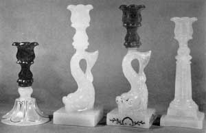 The Three Principal Designs: Left to right, the Loop-and-Petal; the Dolphin; and the Fluted-Column. Two show original applied gold leaf decoration. Many specimens have lost this through repeated washing. The Three Principal Designs: Left to right, the Loop-and-Petal; the Dolphin; and the Fluted-Column. Two show original applied gold leaf decoration. Many specimens have lost this through repeated washing.