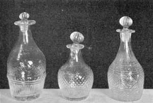 Illustration VII: Three Quarter-Pint Decanters: The one at the extreme left is, in design, the rarest of any of the decanters illustrated with this article. Illustration VII: Three Quarter-Pint Decanters: The one at the extreme left is, in design, the rarest of any of the decanters illustrated with this article.