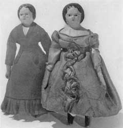 Illustration VI: Two Walking Dolls: Here costume and style of hair dress proclaim the era in which these two little figures were made. Illustration VI: Two Walking Dolls: Here costume and style of hair dress proclaim the era in which these two little figures were made.