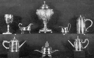 Virginia Silver of American Make: Left to right, top row: 18-Century stirrup cup — engraved, John Gilchrist to Philip Barraud — as inherited in the Cocke family; Paul Revere gravy boat; coffee urn by Christian Wiltberger, Philadelphia, 1770-1851, from Westover; Curtis family cream pitcher by Adam Lynn, Alexandria, 1796; tankard by R. Greene, Boston, 1707-1777, also from the Cocke family. Bottom row, left to right: Teapot, Joseph Anthony, Philadelphia, 1783-1814; covered butter dish, Paul Revere; teapot, also by Revere, Boston, 1735-1818. Virginia Silver of American Make: Left to right, top row: 18-Century stirrup cup — engraved, John Gilchrist to Philip Barraud — as inherited in the Cocke family; Paul Revere gravy boat; coffee urn by Christian Wiltberger, Philadelphia, 1770-1851, from Westover; Curtis family cream pitcher by Adam Lynn, Alexandria, 1796; tankard by R. Greene, Boston, 1707-1777, also from the Cocke family. Bottom row, left to right: Teapot, Joseph Anthony, Philadelphia, 1783-1814; covered butter dish, Paul Revere; teapot, also by Revere, Boston, 1735-1818.