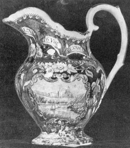 1. The first piece of "Old Blue" Staffordshire acquired by Mrs. Larsen, leading authority on this ware — a pitcher bearing a border of State names, figures of America and Independence and a medallion landscape of an English Castle. Made by James & Ralph Clews. 1. The first piece of "Old Blue" Staffordshire acquired by Mrs. Larsen, leading authority on this ware — a pitcher bearing a border of State names, figures of America and Independence and a medallion landscape of an English Castle. Made by James & Ralph Clews.