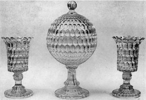 3. Pair of 16-inch celery vases and a globular compote in the Thumbprint pattern. Their grace and brilliance are similar to English or Irish cut glass. Probably made by Bakewell, Pears, and Company in the '60s. 3. Pair of 16-inch celery vases and a globular compote in the Thumbprint pattern. Their grace and brilliance are similar to English or Irish cut glass. Probably made by Bakewell, Pears, and Company in the '60s.
