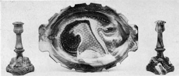 6. Notch-edge platter and a pair of dolphin candlesticks in purple Marble glass. Their careful designing suggests that, contrary to general belief they are not "off-hand" pieces made by individual workmen at the end of the day for personal purposes. 6. Notch-edge platter and a pair of dolphin candlesticks in purple Marble glass. Their careful designing suggests that, contrary to general belief they are not "off-hand" pieces made by individual workmen at the end of the day for personal purposes.