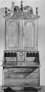 A Carved Walnut Secretary: It was made in Philadelphia circa 1760 for a Lancaster County, Pennsylvania, family. In form and ornamental carving, particularly of the front of the bonnet top, the quarter-round pilasters of both upper and lower sections and the carved shell door of the interior are all representative of the finest Philadelphia craftsmanship. A Carved Walnut Secretary: It was made in Philadelphia circa 1760 for a Lancaster County, Pennsylvania, family. In form and ornamental carving, particularly of the front of the bonnet top, the quarter-round pilasters of both upper and lower sections and the carved shell door of the interior are all representative of the finest Philadelphia craftsmanship.