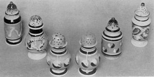 Cat's-Eye and Snake Design: All are early 19th-Century English pottery. The cat's-eyes are in blue-and-white against a tan background; the snake coils are in brown-and-white against a blue background. Cat's-Eye and Snake Design: All are early 19th-Century English pottery. The cat's-eyes are in blue-and-white against a tan background; the snake coils are in brown-and-white against a blue background.