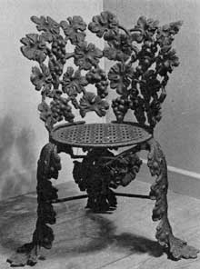 Chair in Grape Design: Leaves, bunches of grapes and vine tendrils were carefully arranged to form the structure of the wrought-iron chair with circular seat. Chair in Grape Design: Leaves, bunches of grapes and vine tendrils were carefully arranged to form the structure of the wrought-iron chair with circular seat.