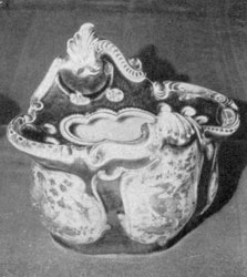 Dr. Wall Worcester Crocus Pot: A fine example of scale blue from this pottery of the Dr. Wall period. It is also decorated with scenic reserves painted in naturalistic coloring. Made circa 1765-1770. Dr. Wall Worcester Crocus Pot: A fine example of scale blue from this pottery of the Dr. Wall period. It is also decorated with scenic reserves painted in naturalistic coloring. Made circa 1765-1770.