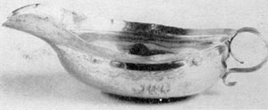 Illustration VIII: Early 19th-Century Pap Cup: William Thomson worked in New York as a silversmith until 1834. His touch-marks were frequently "W. Thomson" in script letters, "New York" in Roman capital letters, and the year the piece was made in Arabic numerals. Illustration VIII: Early 19th-Century Pap Cup: William Thomson worked in New York as a silversmith until 1834. His touch-marks were frequently "W. Thomson" in script letters, "New York" in Roman capital letters, and the year the piece was made in Arabic numerals.