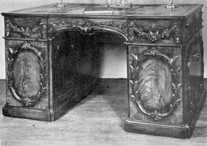 English Pedestal Writing Table: Made in London, this mahogany piece, elaborately decorated with carved festoons, wreaths, and shell patterns, is very similar to the plate in the first edition of the Director entitled "A Library Table." English Pedestal Writing Table: Made in London, this mahogany piece, elaborately decorated with carved festoons, wreaths, and shell patterns, is very similar to the plate in the first edition of the Director entitled "A Library Table."