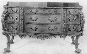 A French Taste Commode Bureau: The design and ornamentation of this piece, executed in mahogany with ornate bronze mounts, follows as closely as any piece could one of the plates in Chippendale's Director. The elaborate carving and shaping of the piece is representative of Chippendale designs in the French taste. A French Taste Commode Bureau: The design and ornamentation of this piece, executed in mahogany with ornate bronze mounts, follows as closely as any piece could one of the plates in Chippendale's Director. The elaborate carving and shaping of the piece is representative of Chippendale designs in the French taste.