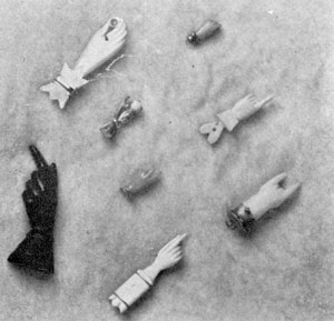 Hands with Important Finger Positions: Extreme right, lower shows bone hand with first and last fingers pointing out denotes a warning or protection from the evil eye. Small wooden hand in center right with first finger extended is a warning to keep away. Upper right, small coral hand with fingers doubled denotes affection. Hands with Important Finger Positions: Extreme right, lower shows bone hand with first and last fingers pointing out denotes a warning or protection from the evil eye. Small wooden hand in center right with first finger extended is a warning to keep away. Upper right, small coral hand with fingers doubled denotes affection.
