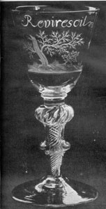 Illustration III: The Revirescit Goblet: Beneath the wording the decoration is that of a stricken oak with a young sapling springing up nearby. On the reverse are engraved an eight-petalled Stuart rose and two buds. The stem has in air twist with double knobs. This goblet relents the efforts of the Stuarts to regain the English throne. Made about 1750, it is commemorative of the defeat of the Young Pretender at the Battle of Culloden. Illustration III: The Revirescit Goblet: Beneath the wording the decoration is that of a stricken oak with a young sapling springing up nearby. On the reverse are engraved an eight-petalled Stuart rose and two buds. The stem has in air twist with double knobs. This goblet relents the efforts of the Stuarts to regain the English throne. Made about 1750, it is commemorative of the defeat of the Young Pretender at the Battle of Culloden.