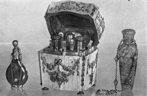 Illustration III: Lapis Perfume Bottle, mounted in Gold, French, 19th Century. Mother of Pearl and Gold Vanity Case, completely fitted, English, c. 1770. Perfume Bottle, petrified wood and gold, English, 19th Century. Illustration III: Lapis Perfume Bottle, mounted in Gold, French, 19th Century. Mother of Pearl and Gold Vanity Case, completely fitted, English, c. 1770. Perfume Bottle, petrified wood and gold, English, 19th Century.
