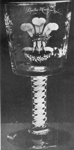 Illustration V: A George III Goblet: This was decorated with painted enamel in colors and bears the signature of the artist, "Beilby N. Castle invt. & pinxt." The decoration on one side is the Prince of Wales Feathers and on the other the Royal Arms and motto as borne by George III. Made about 1762 to commemorate the birth of his eldest son, later George IV. Illustration V: A George III Goblet: This was decorated with painted enamel in colors and bears the signature of the artist, "Beilby N. Castle invt. & pinxt." The decoration on one side is the Prince of Wales Feathers and on the other the Royal Arms and motto as borne by George III. Made about 1762 to commemorate the birth of his eldest son, later George IV.