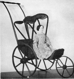 A Jenny Lind Doll: This is known to have been a gift in 1866. It has a German china head with blue eyes and black hair. The body is of kid. This doll is seated in a Joel Ellis doll carriage of the same period. A Jenny Lind Doll: This is known to have been a gift in 1866. It has a German china head with blue eyes and black hair. The body is of kid. This doll is seated in a Joel Ellis doll carriage of the same period.