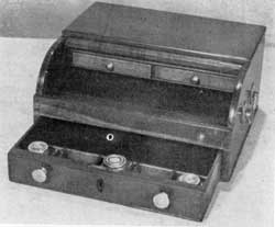 Lady's Mahogany Tambour Ink Stand: While this one has no inlay, others of the same general design were richly decorated with delicate inlay on the drawer fronts and were bound with brass. Sometimes they had brass feet and others also brass fretwork around the edges of the top. Lady's Mahogany Tambour Ink Stand: While this one has no inlay, others of the same general design were richly decorated with delicate inlay on the drawer fronts and were bound with brass. Sometimes they had brass feet and others also brass fretwork around the edges of the top.