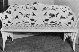 Large Cast-Iron Bench in Fern Design: Here in back, arms and legs ferns were used as the motif. The back has a careful executed design that is balanced and symmetrical. Large Cast-Iron Bench in Fern Design: Here in back, arms and legs ferns were used as the motif. The back has a careful executed design that is balanced and symmetrical.
