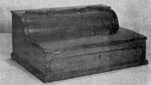 Late Tambour Desk of Walnut: A fairly common and rather crude type made in the latter part of the 19th Century. Size, 12 1/2 by 91/2 by 5 1/2 inches. Late Tambour Desk of Walnut: A fairly common and rather crude type made in the latter part of the 19th Century. Size, 12 1/2 by 91/2 by 5 1/2 inches.