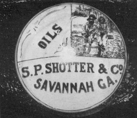 Millville Commercial Product: This paperweight, used for advertising by S. P. Shotter el Co., Savannah, Georgia, dealers in oils and turpentine, is of the picture type made at Millville. In the upper right-hand corner can be seen a typical scene at a Georgia turpentine distillery. Millville Commercial Product: This paperweight, used for advertising by S. P. Shotter el Co., Savannah, Georgia, dealers in oils and turpentine, is of the picture type made at Millville. In the upper right-hand corner can be seen a typical scene at a Georgia turpentine distillery.