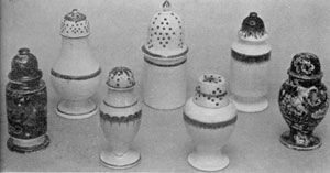Of Leeds and Staffordshire Ware: The five pepper pots in the center are Leeds. They are of cream-white pottery with simple decoration in blue or green. The two at the extreme left and right are Staffordshire with deep-blue transfer decoration. Of Leeds and Staffordshire Ware: The five pepper pots in the center are Leeds. They are of cream-white pottery with simple decoration in blue or green. The two at the extreme left and right are Staffordshire with deep-blue transfer decoration.