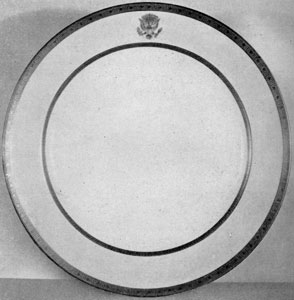 Plate from the Wilson Service: This White House dinner service was decorated with etched gold borders and the presidential seal of raised gold paste. The service was also used during the Harding, Coolidge and Hoover administrations. Plate from the Wilson Service: This White House dinner service was decorated with etched gold borders and the presidential seal of raised gold paste. The service was also used during the Harding, Coolidge and Hoover administrations.