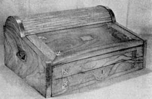 Portable Desk Made in China: Of camphor wood it has brass bindings, inlays and recessed locks and handles. The tambour top is at rear. Such desks were carried by sea captains to all parts of the world for barter. Size 19 1/2 by 15 by 9 1/4 inches. Portable Desk Made in China: Of camphor wood it has brass bindings, inlays and recessed locks and handles. The tambour top is at rear. Such desks were carried by sea captains to all parts of the world for barter. Size 19 1/2 by 15 by 9 1/4 inches.